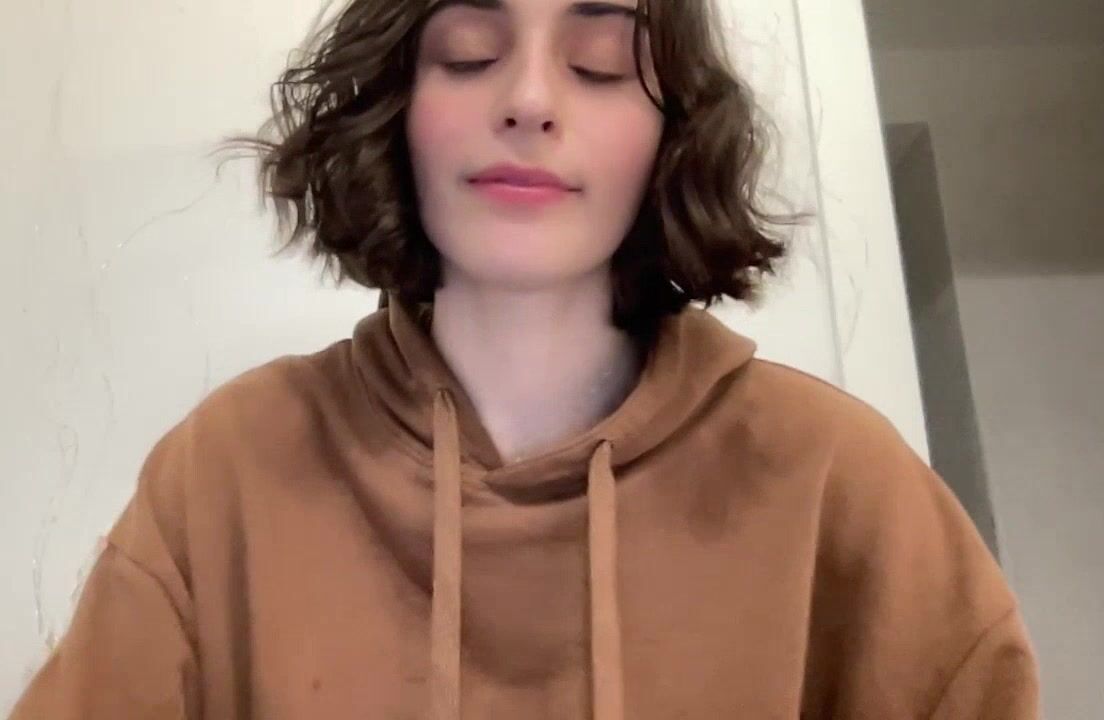 A sigh escapes her lips